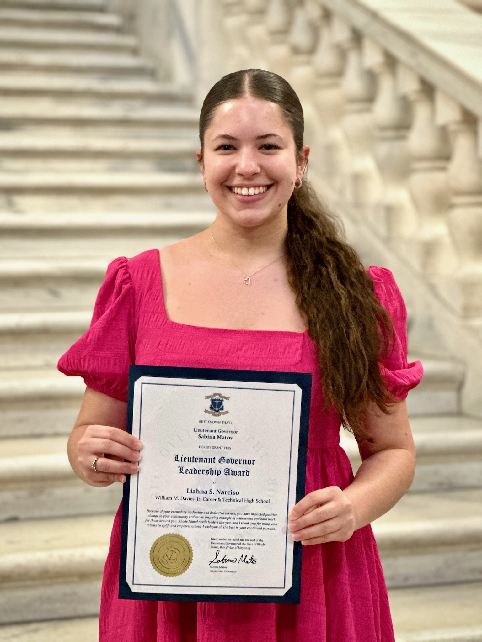 Liahna Narciso holding her Lieutenant Governor Leadership Award