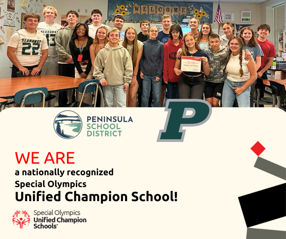 A group of students pose together, celebrating their recognition as a Unified Champion School.
