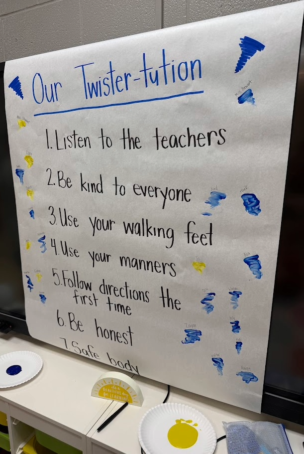 A classroom poster titled 'Our Twister-tution' lists rules for students.