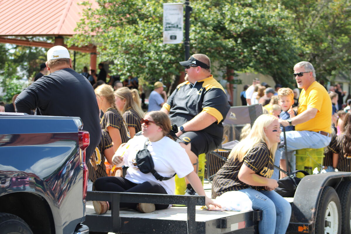 Softball float with students and coaches on a trailer