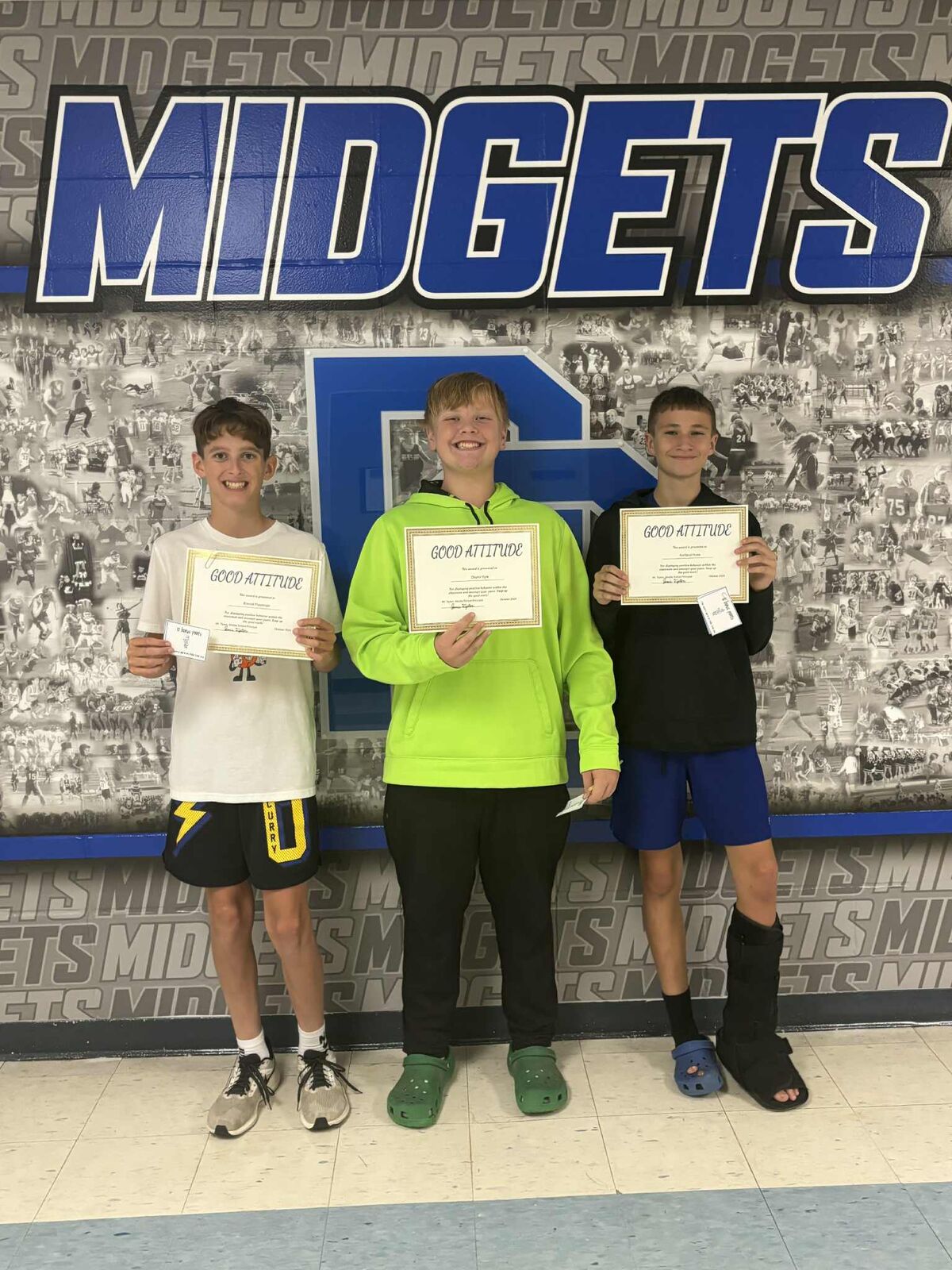 good attitude winners smiling while holding certificates