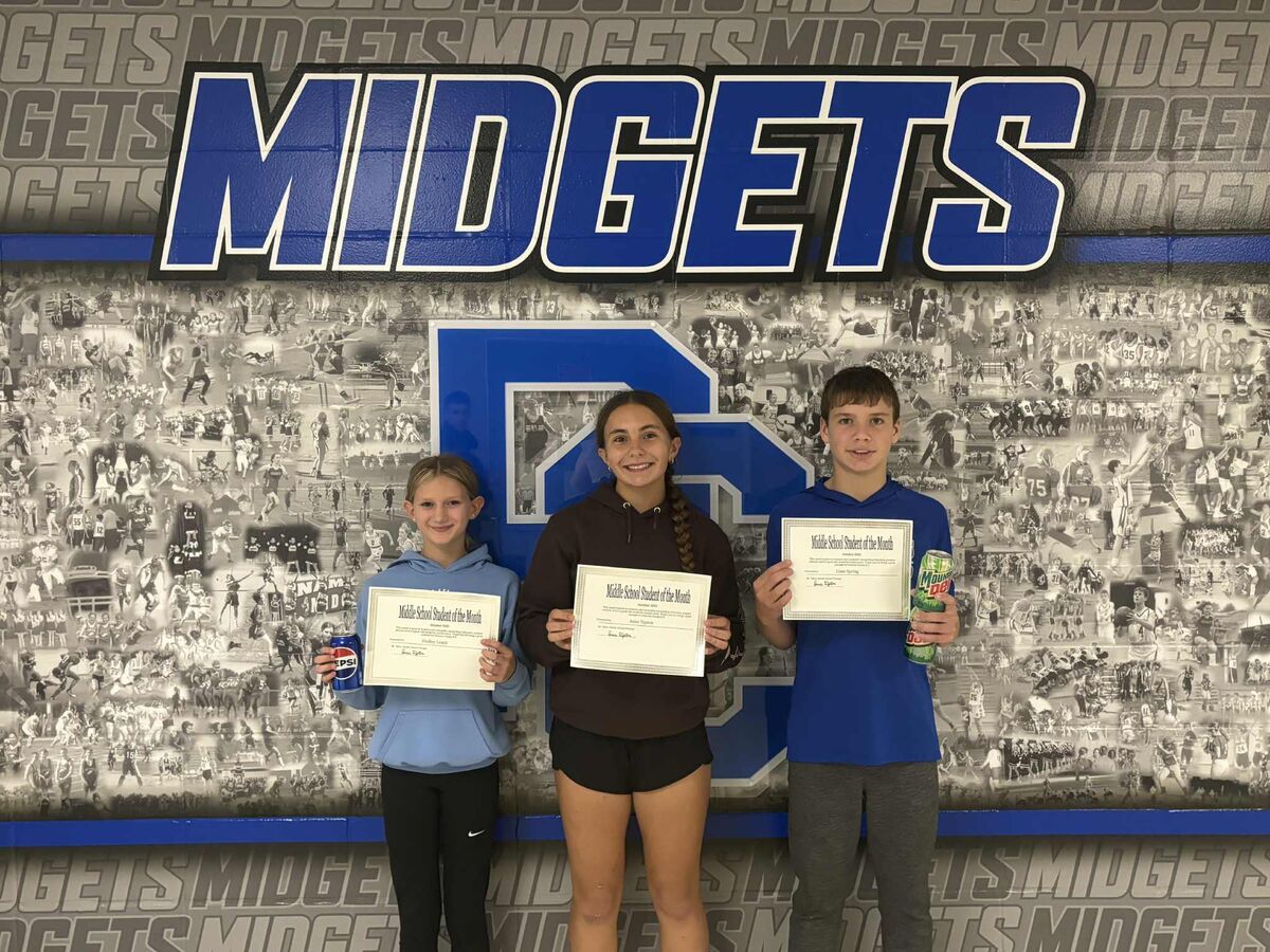 three students smiling while holding certificates
