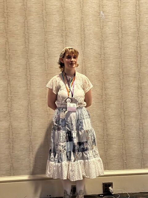 Student receiving award for costume design