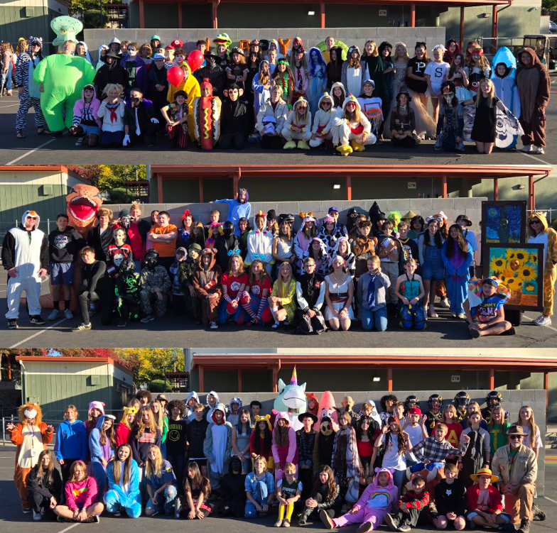 A large group of people pose together, many in colorful costumes.