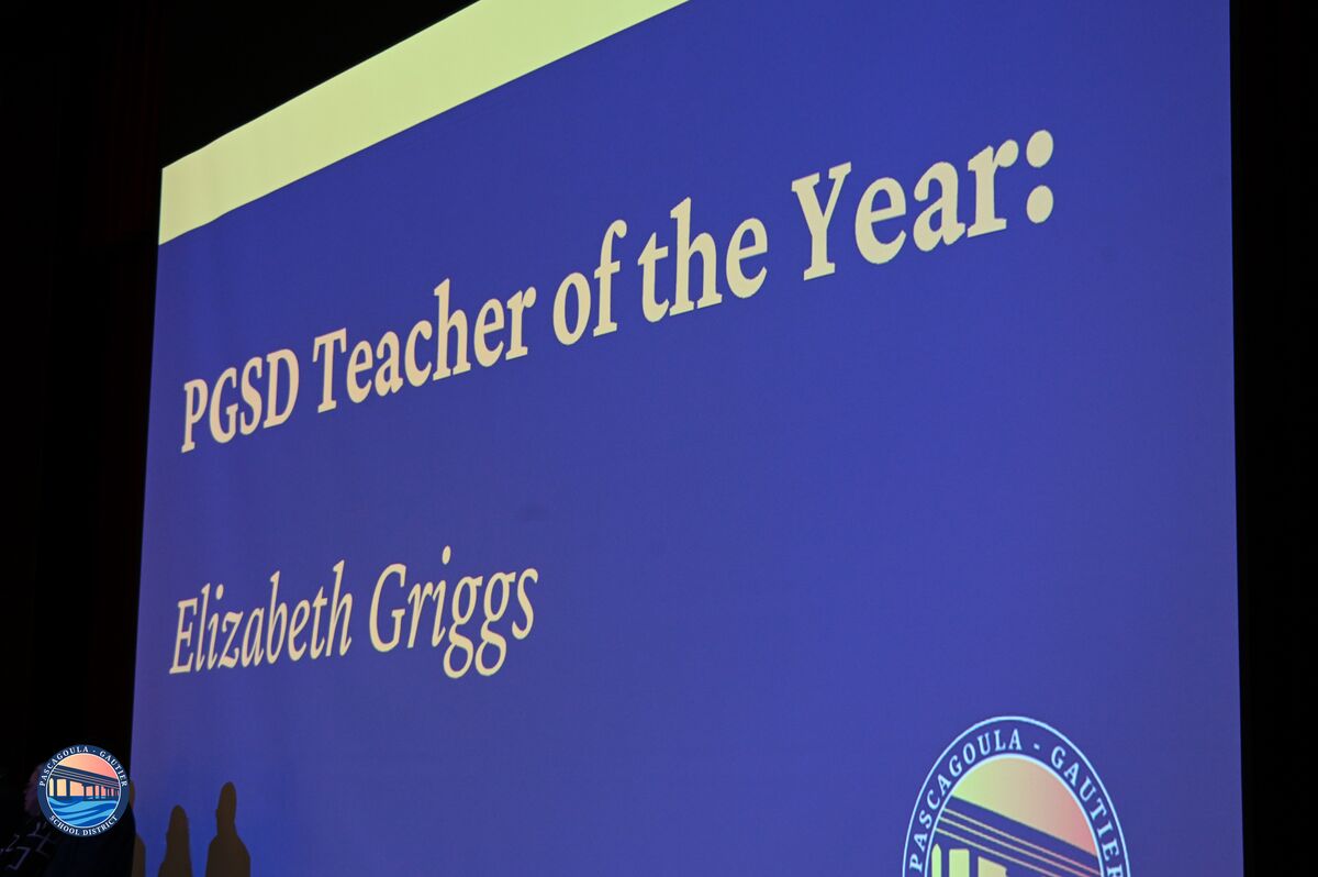 A screen displays the text 'PGSD Teacher of the Year: Elizabeth Griggs'.