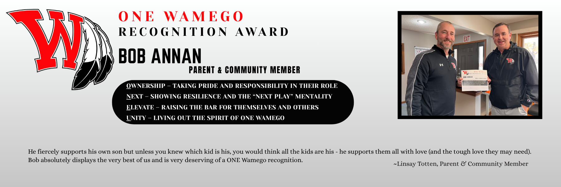 ONE Wamego Recognition Award presented to Bob Annan, Parent and Community Member. The poster displays the Wamego ‘W’ logo and core values Ownership, Next, Elevate, Unity. Below, a quote from Linsay Totten commends Bob’s strong support for all students, not just his own. The right-side photo shows Bob receiving the award certificate from a school representative inside a school office.