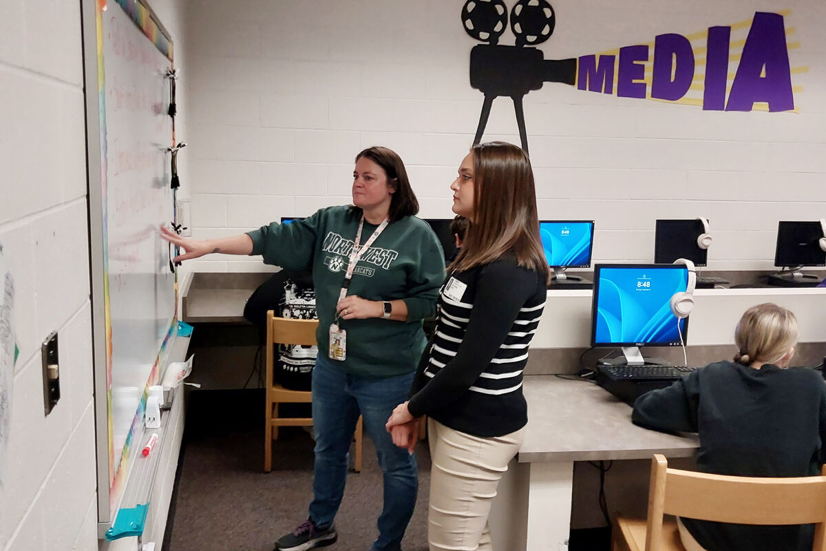 Kearney Junior High teacher Molly Kuebler, left, talks with KCTV5 reporter Katie Byrd about the video projects her students are working on.