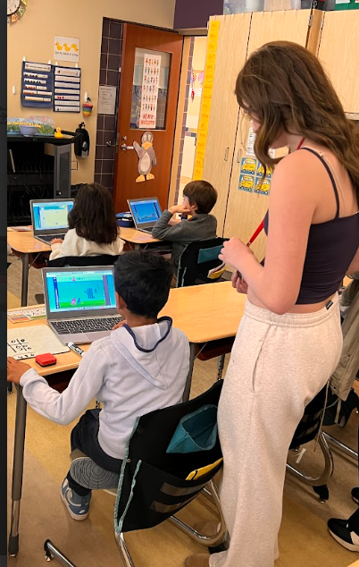 MMS Student helps second grader with ST Math