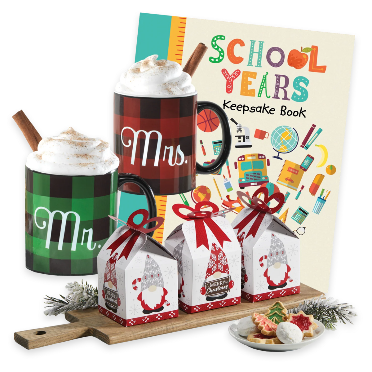 Two mugs with whipped cream and cinnamon sticks, a school keepsake book, and gift boxes.