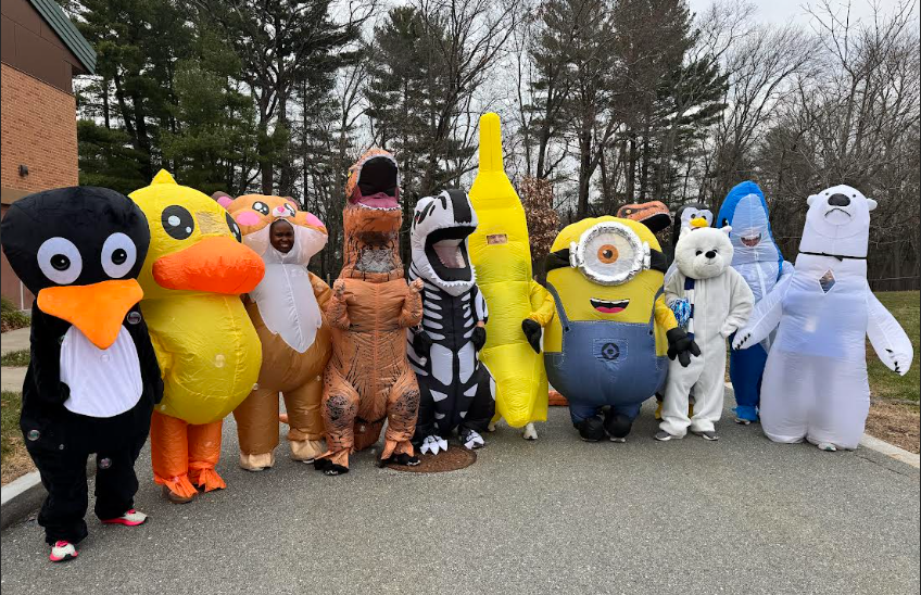 Staff participants in the inflatable race!