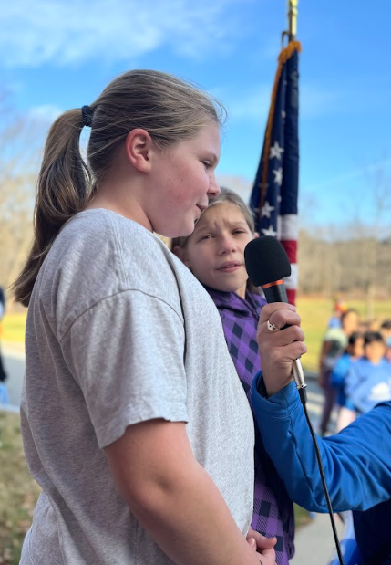Students sing the Star-spangled Banner before the Fun R
