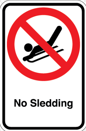 A sign with a red circle and slash over a person sledding.