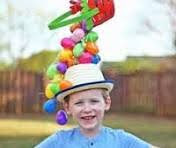 image of a child wearing a hat with balloons