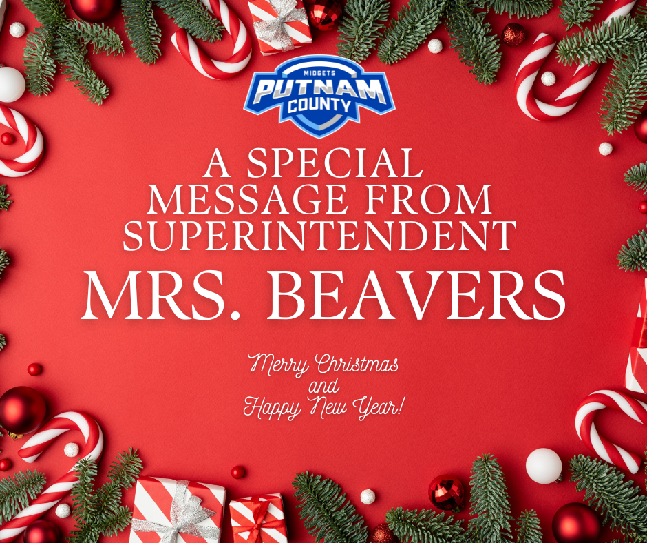 Holiday message from Superintendent Mrs. Jonnie Beavers on a red background with candy canes, pine branches, ornaments, and wrapped gifts. The graphic includes her written holiday message to the Putnam County community.