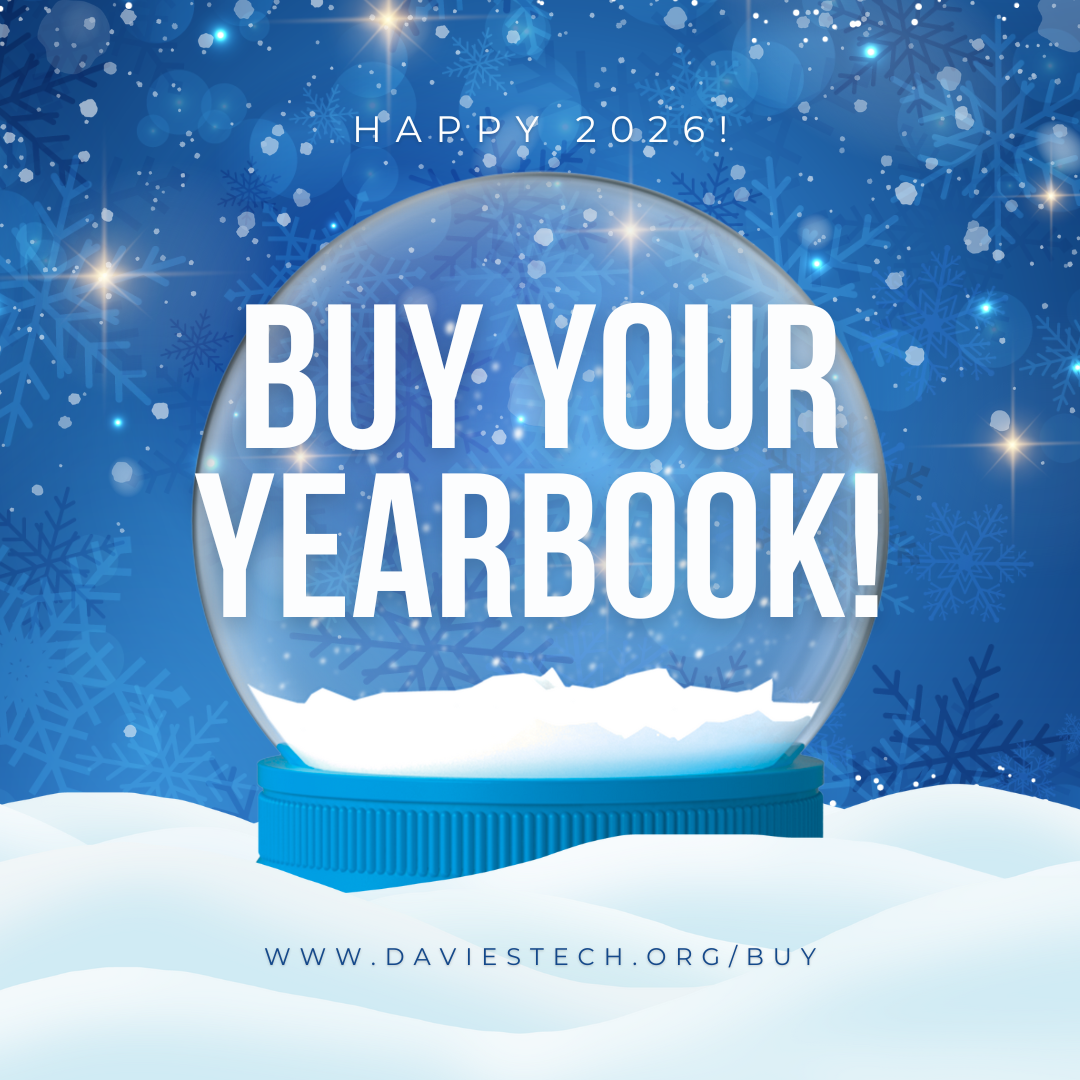 A snow globe with the text 'BUY YOUR YEARBOOK!' inside, set against a blue, snowy background with 'HAPPY 2026!' at the top.