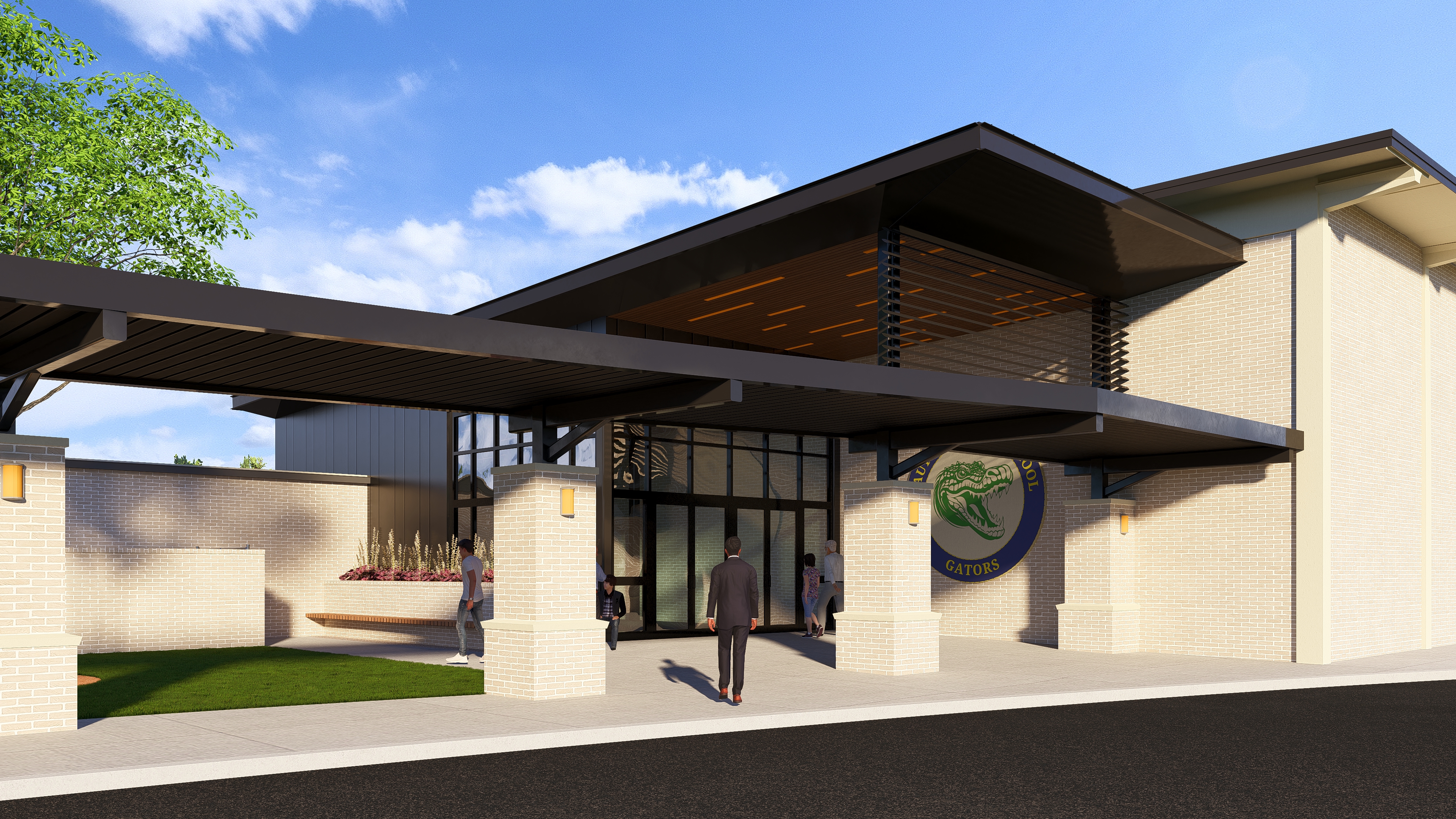 A modern school building entrance with a large circular logo featuring a green alligator and the text 'GATORS'.