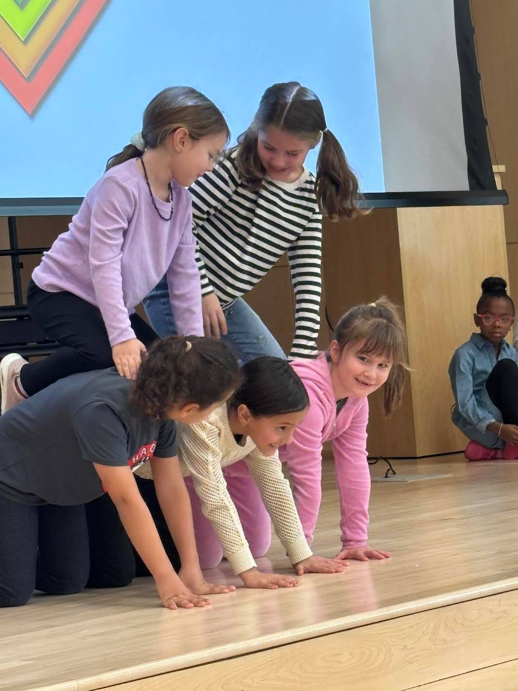 Students show off their talent making a human pyramid.