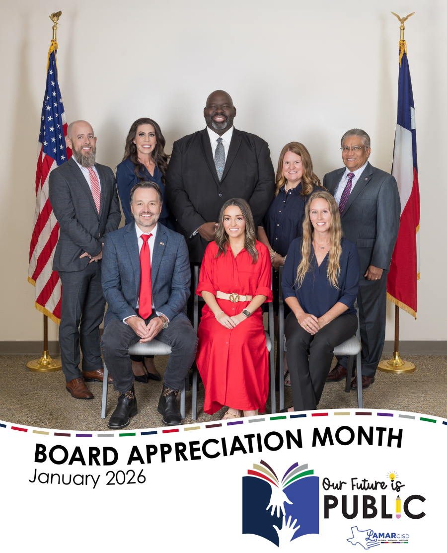 A group of eight individuals, likely a school board, pose for a photo with American and Texas flags.
