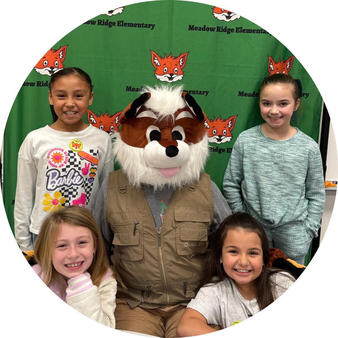 Image of students with mascot