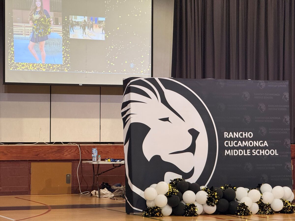 RCMS back drop with RCMS Lion Logo, black and white balloons.