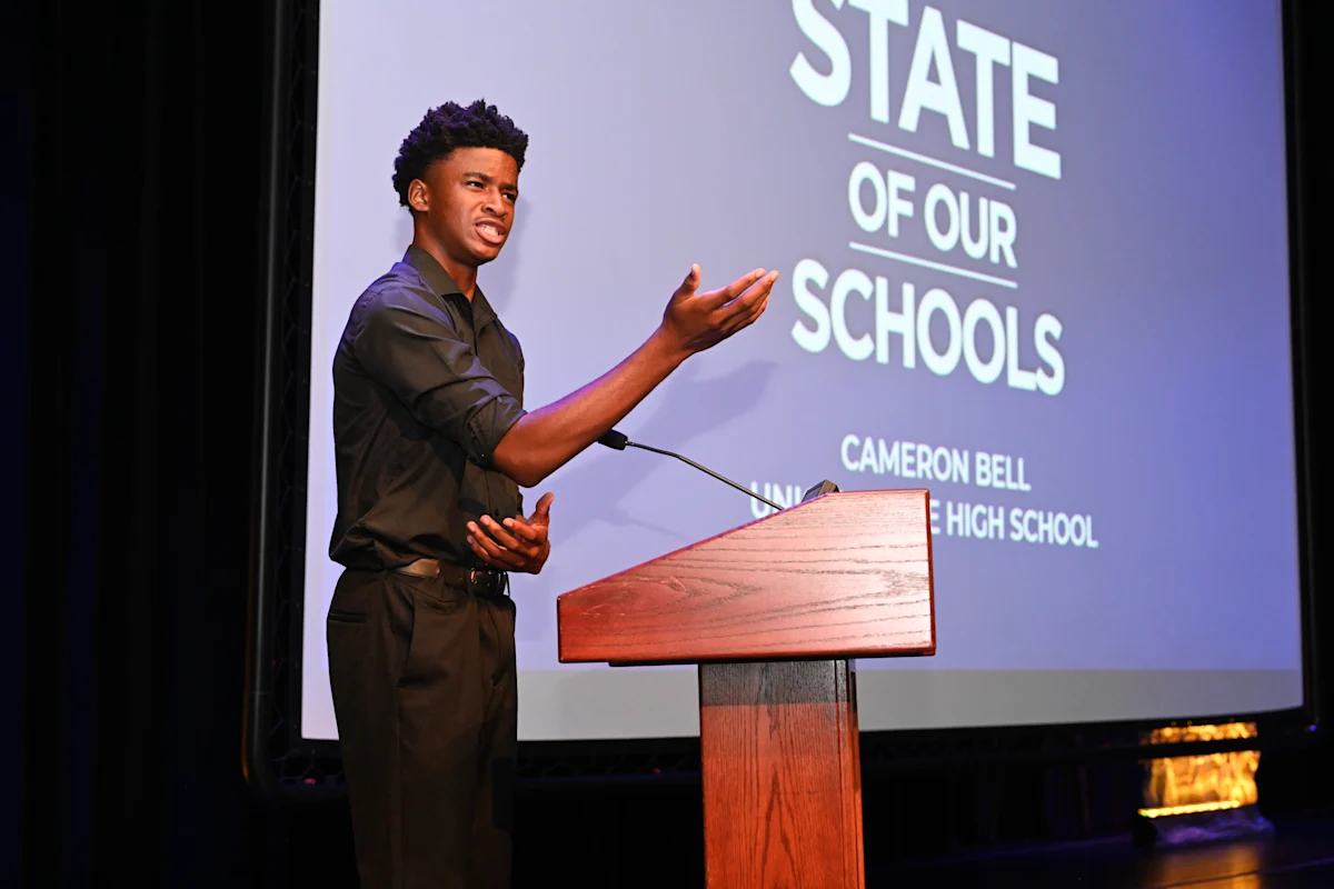 Photo of Union Grove High School student Cameron Bell reciting a poem