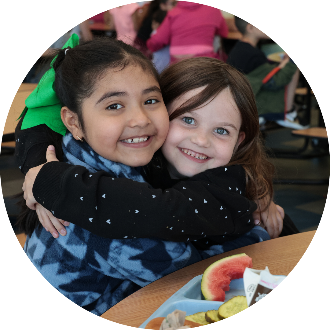 Two students hugging