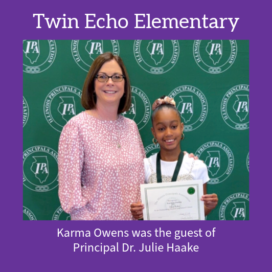 Principal Dr. Julie Haake stands with Karma Owens, who holds a certificate and medal.