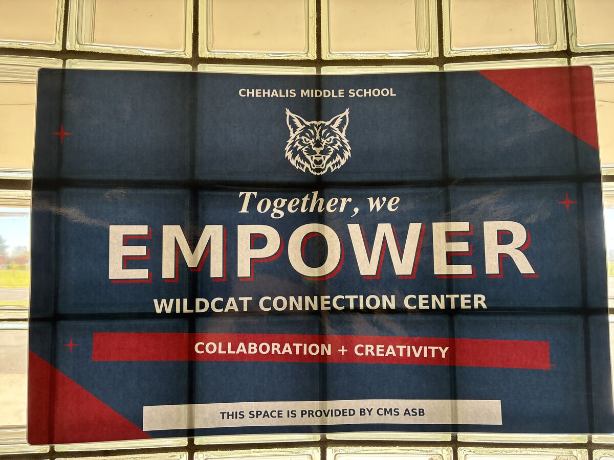 A blue and red sign reads Chehalis Middle School, Together, we EMPOWER, Wildcat Connection Center, Collaboration + Creativity.