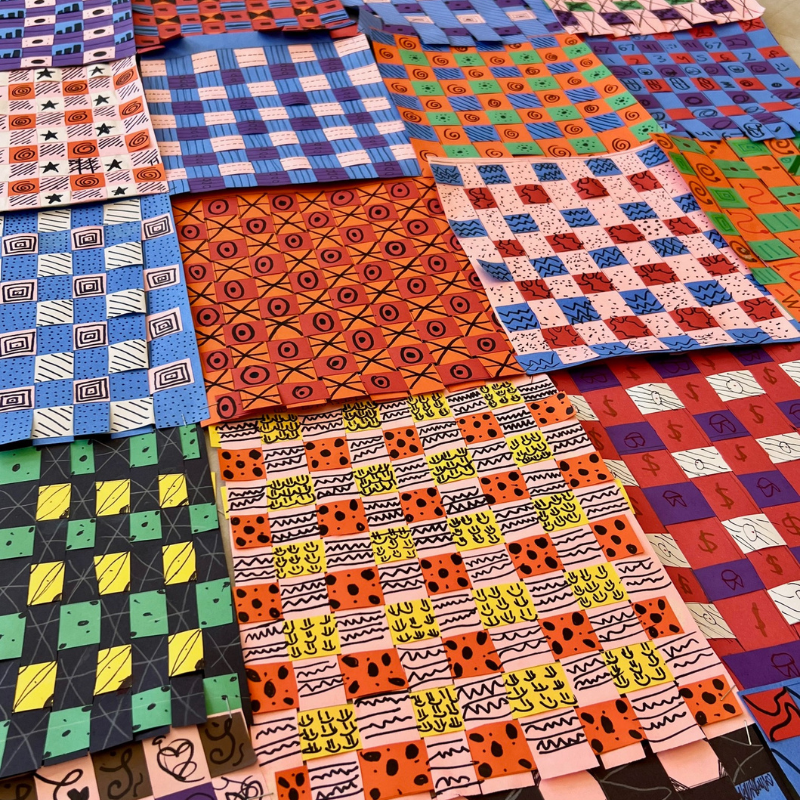 A colorful collection of woven paper art pieces with various patterns and designs.
