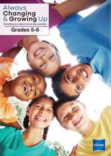 A group of diverse children smile down in a low-angle huddle, with text reading 'Always Changing & Growing Up, Grades 5-6'.