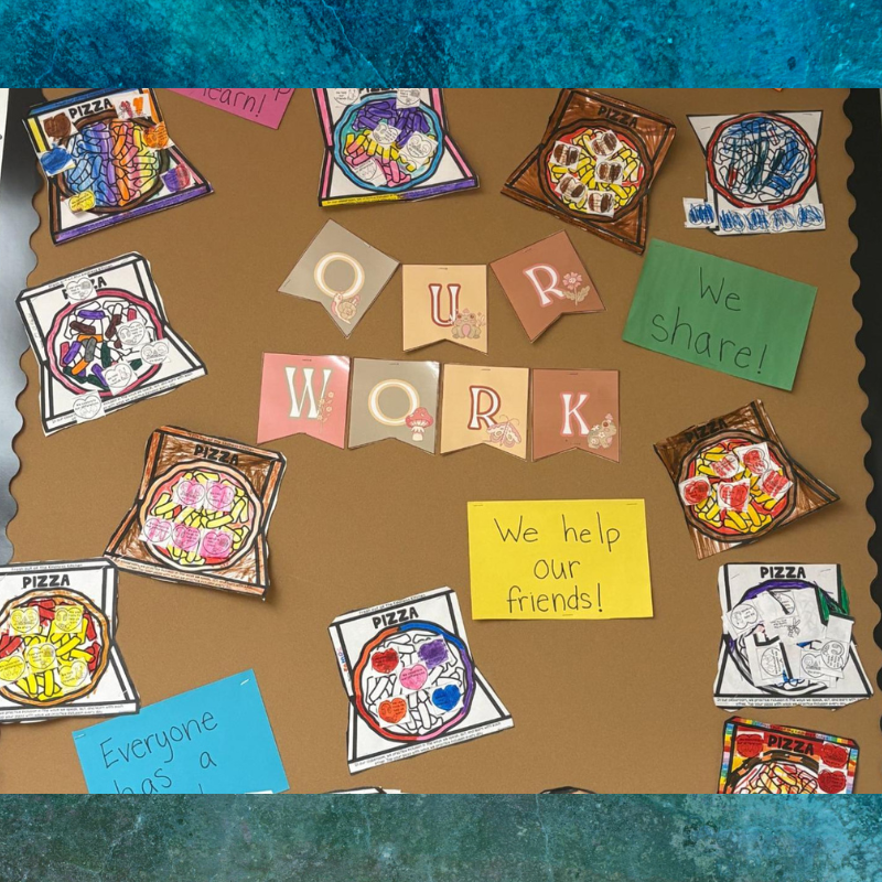 A classroom bulletin board displays colorful drawings of pizzas and the word "WORK" spelled out with decorative banners.