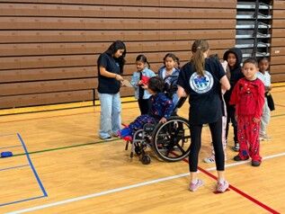 Image of Cucamonga Elementary School's first grade students engaging with middle school students.