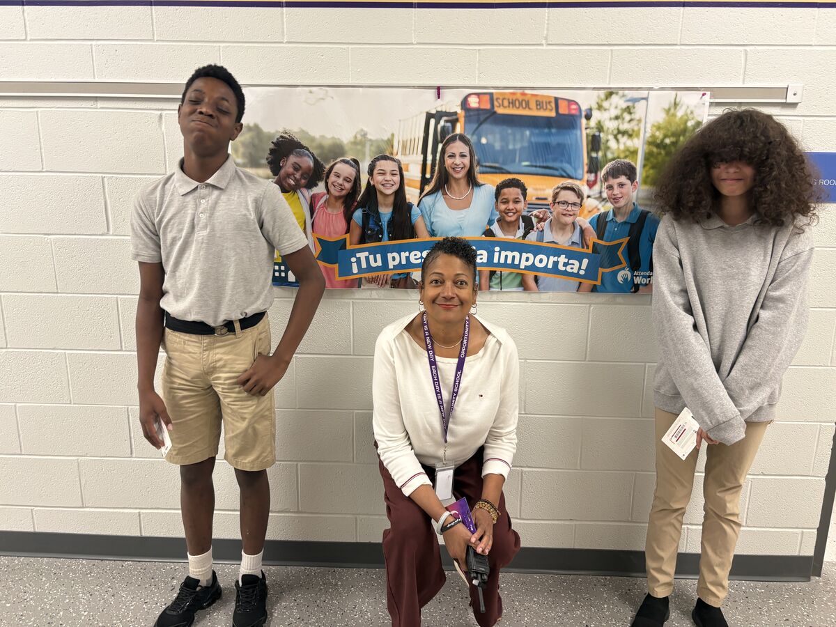 Pictured left to right, student winner, Principal Mack, and another student winner