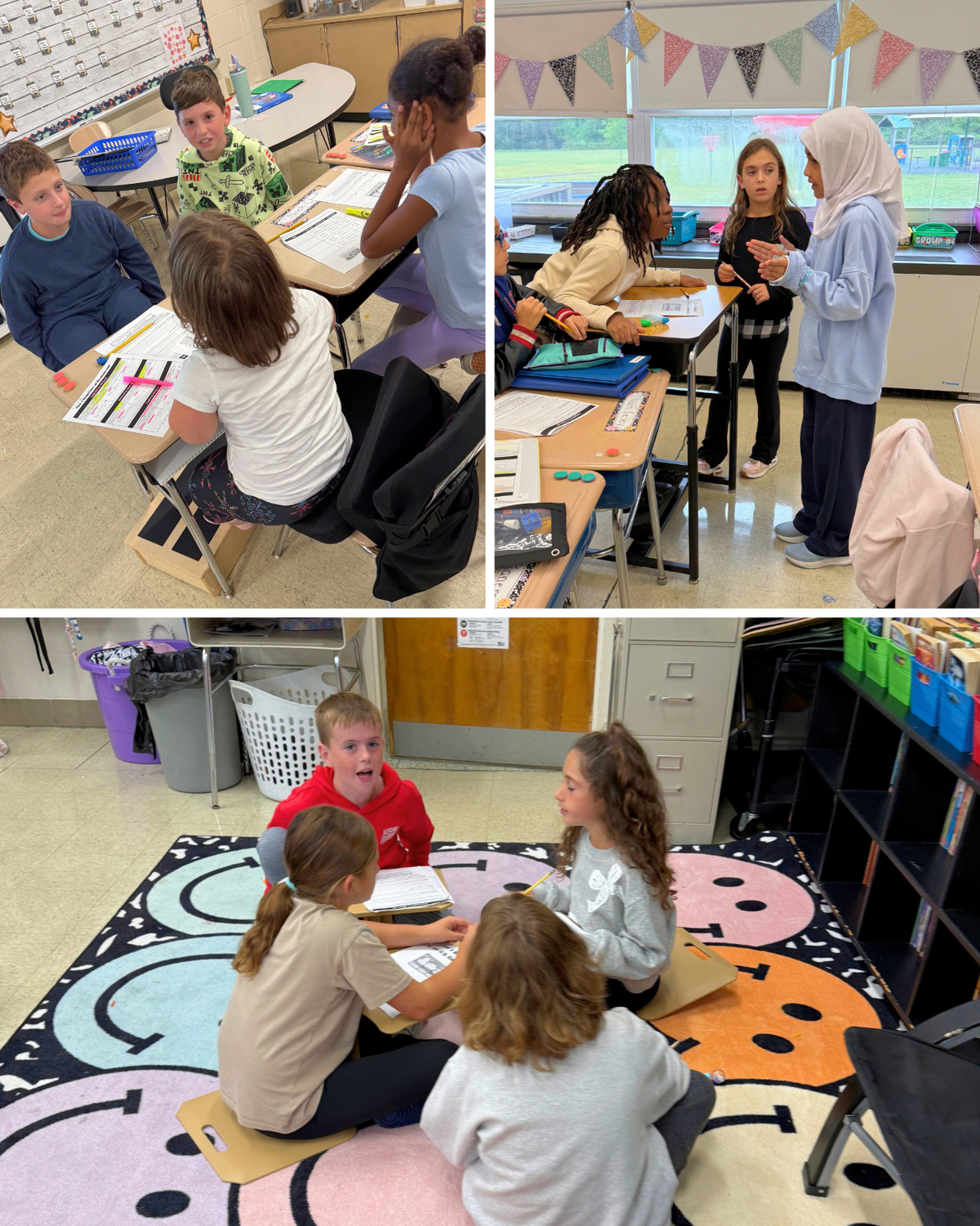 Elementary students collaborate in small groups inside a bright classroom, working at desks and sitting on a patterned rug.