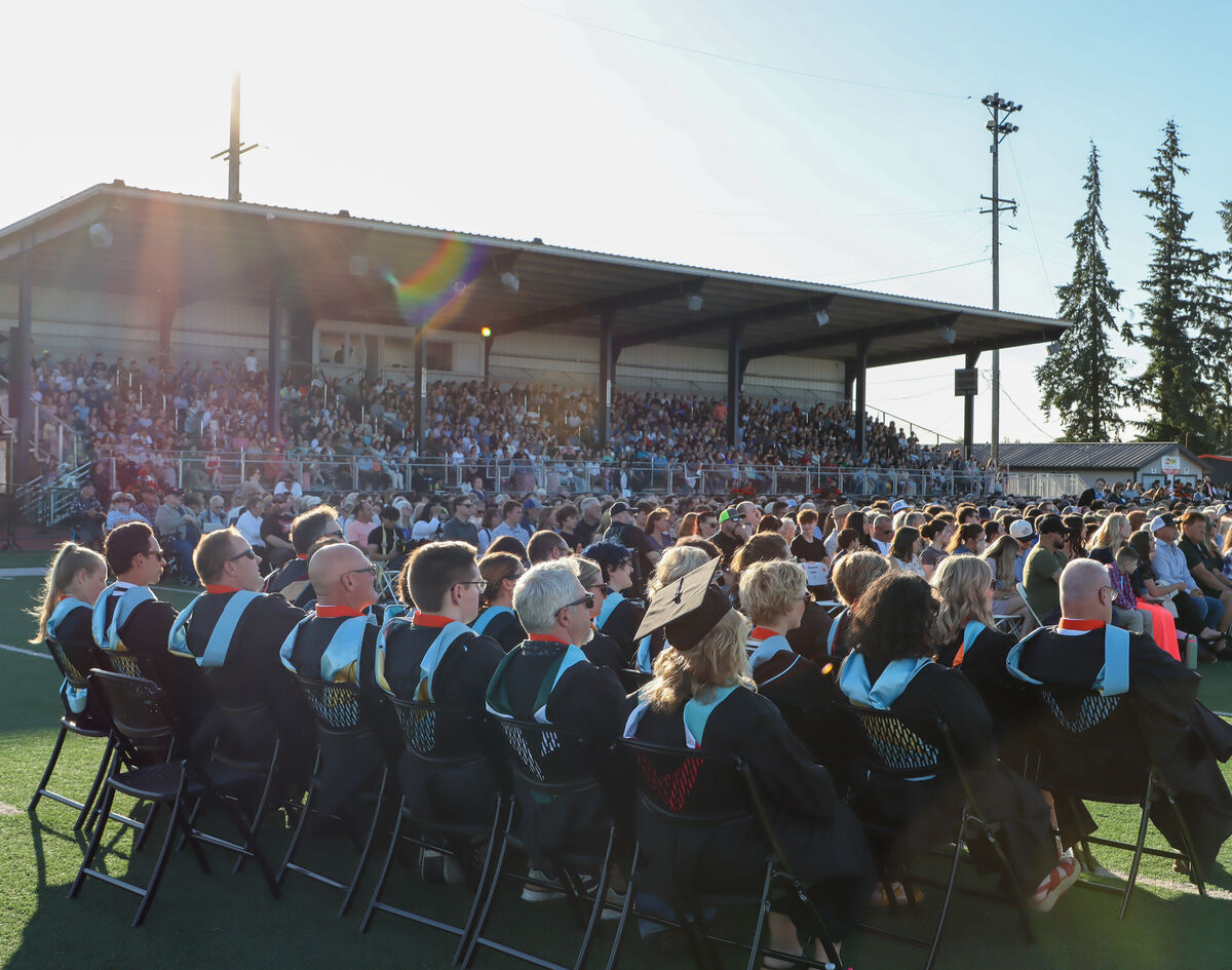 SFSD staff dressed in robes at graduation
