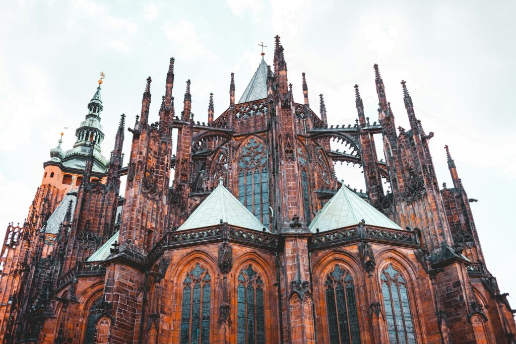 The tall spires of Prague Castle, rising into the sky.