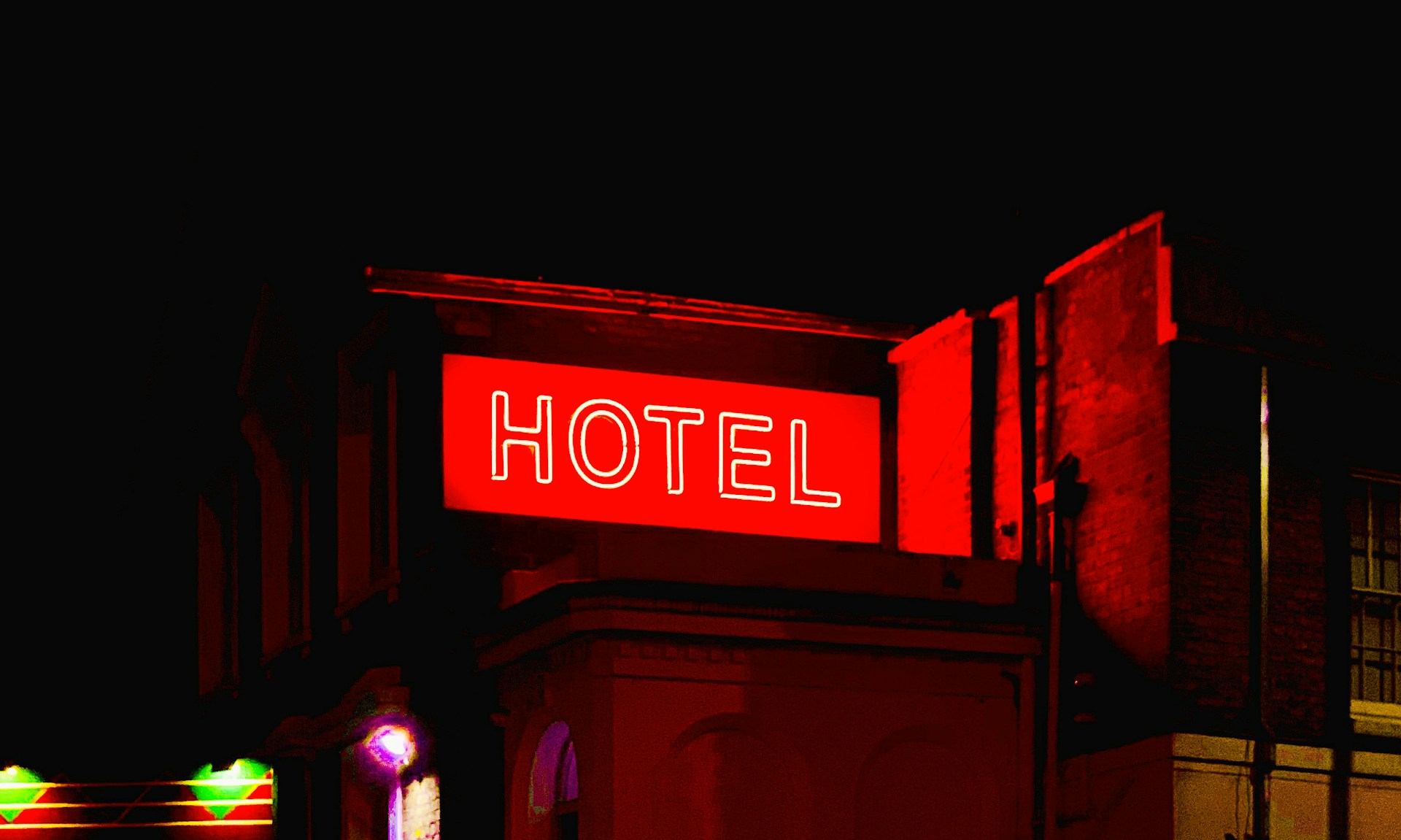 neon sign reading hotel