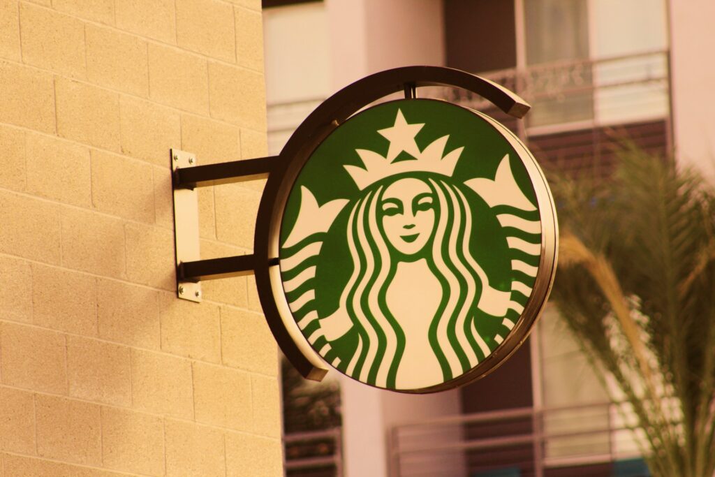 A Starbucks sign on the side of a building