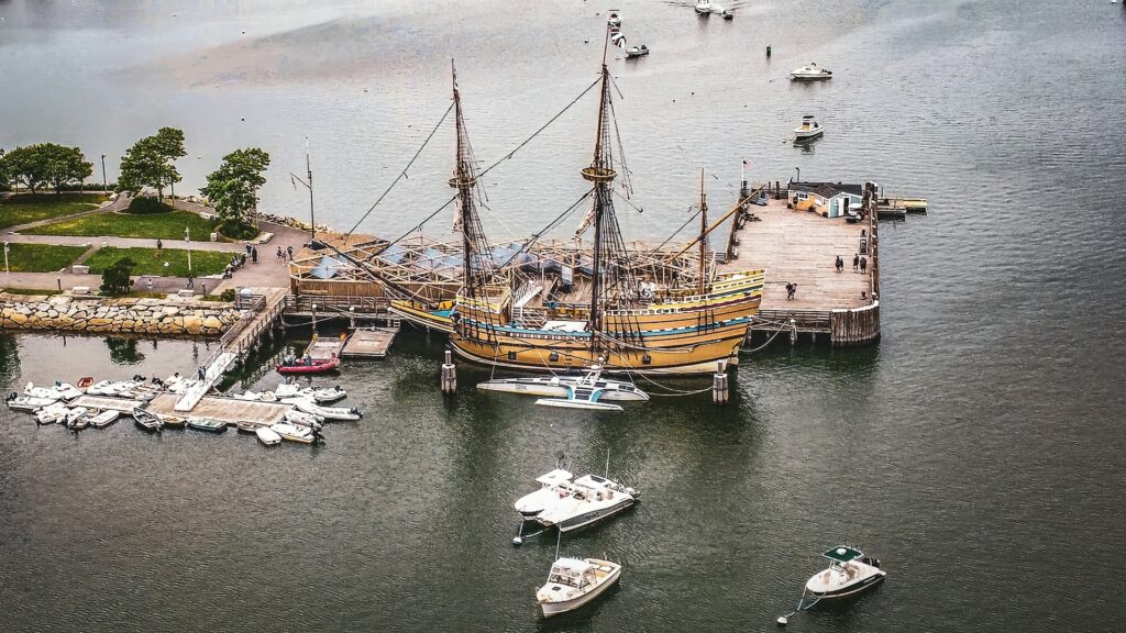 A classic ship docked in Plymouth harbor