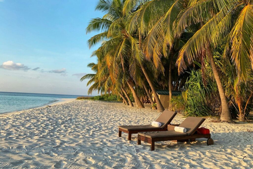Two loungers on a beach in the Maldives