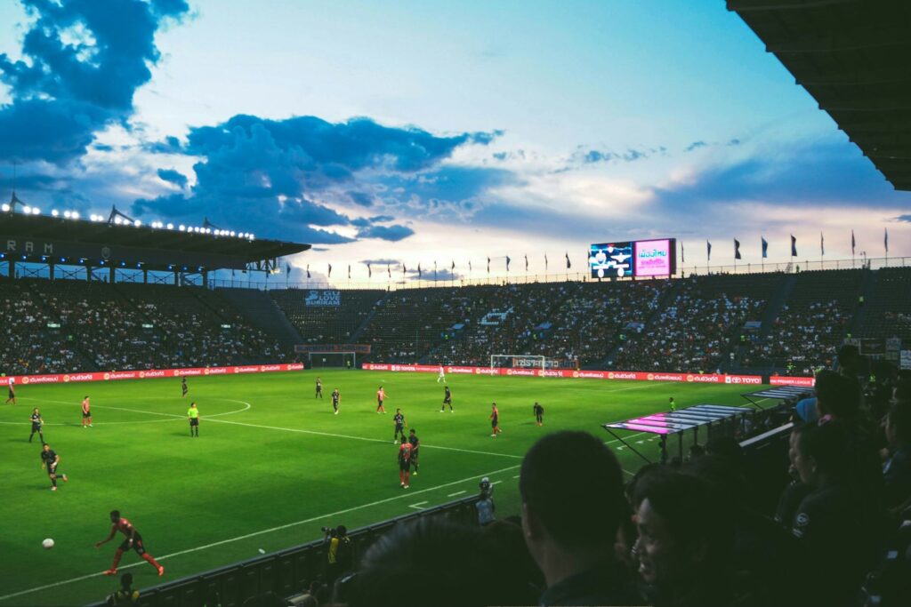 A soccer game at sunset