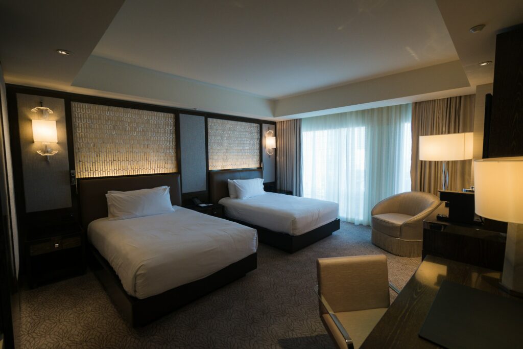 A hotel room with two beds