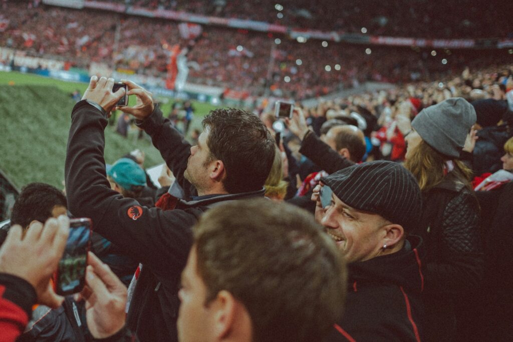 A group of soccer fans enjoying themselves in the stands