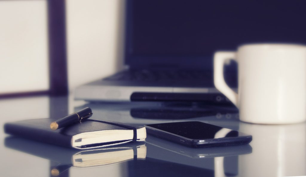 image of coffee cup and notebook with pen