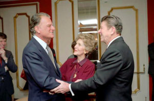 2/5/1981 President Reagan Nancy Reagan and Billy Graham at the National Prayer Breakfast held at the Washington Hilton Hotel