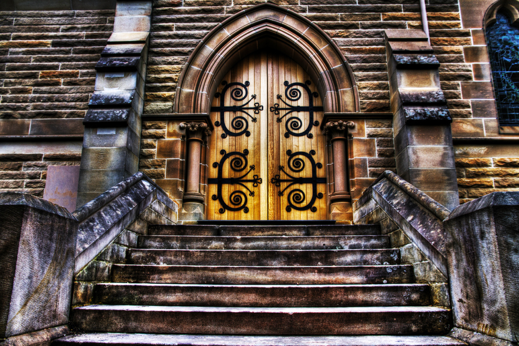 picture of 7 inaccessible steps leading up to church doors