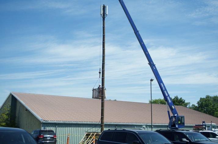 Work on moving cell tower locations began this week - the first step in the Woodside Village construction.