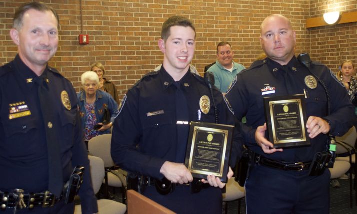 Prairie Village Police Chief Wes Jordan (L-R)) presented the department's Lifesaving Award to officers John Shipman and Joel Colletti.