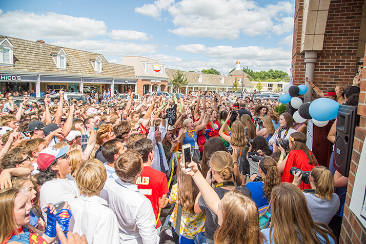 Students packed around the Village Shops clocktower as principal John McKinney riled up the crowd during the 2016 Lancer Day rally at the Village Shops.