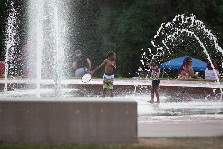 Kids at play in a Corporate Woods fountain at the 2016 SoJo Summerfest.